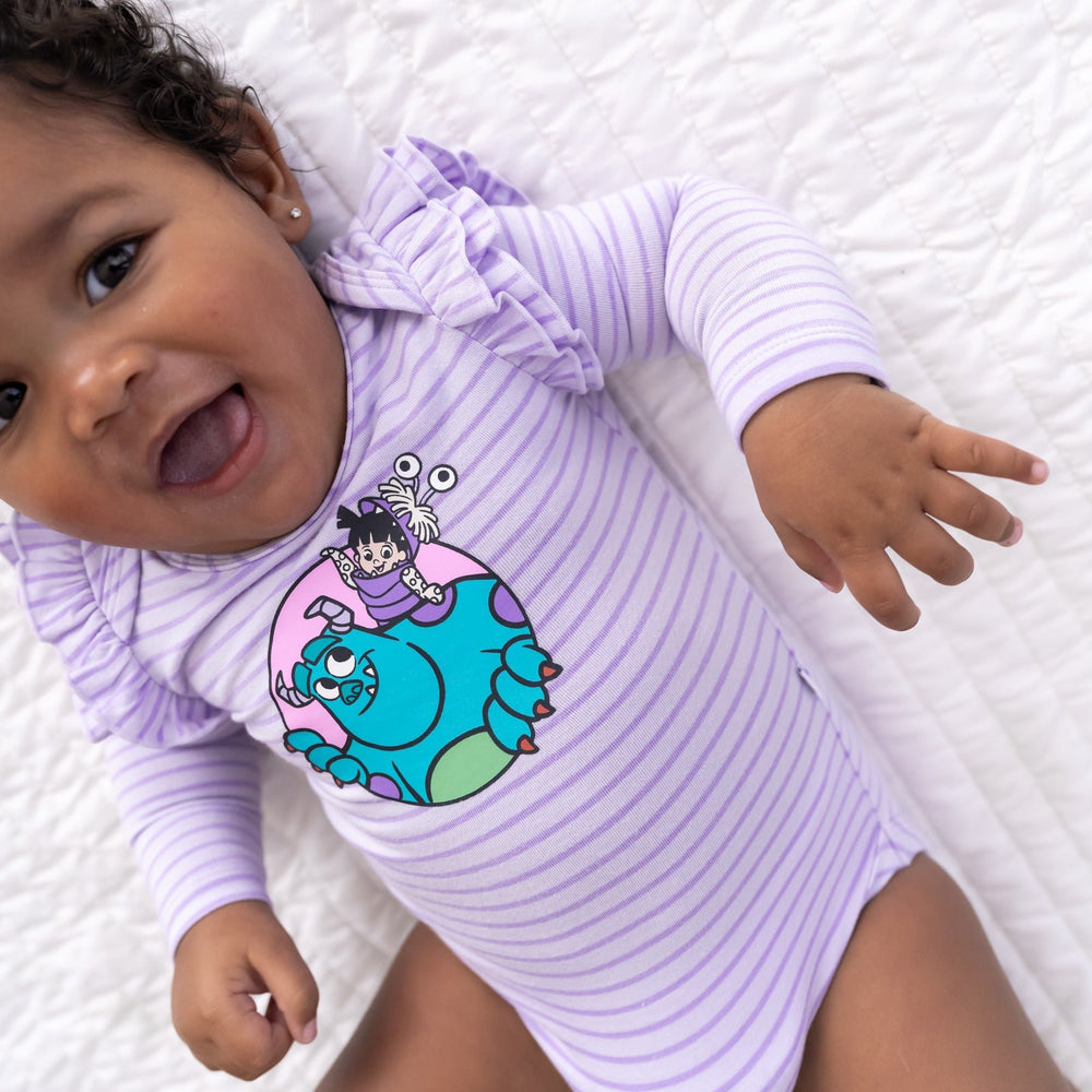 Top view close up image of baby wearing the Disney Monsters, Inc. Flutter Bodysuit