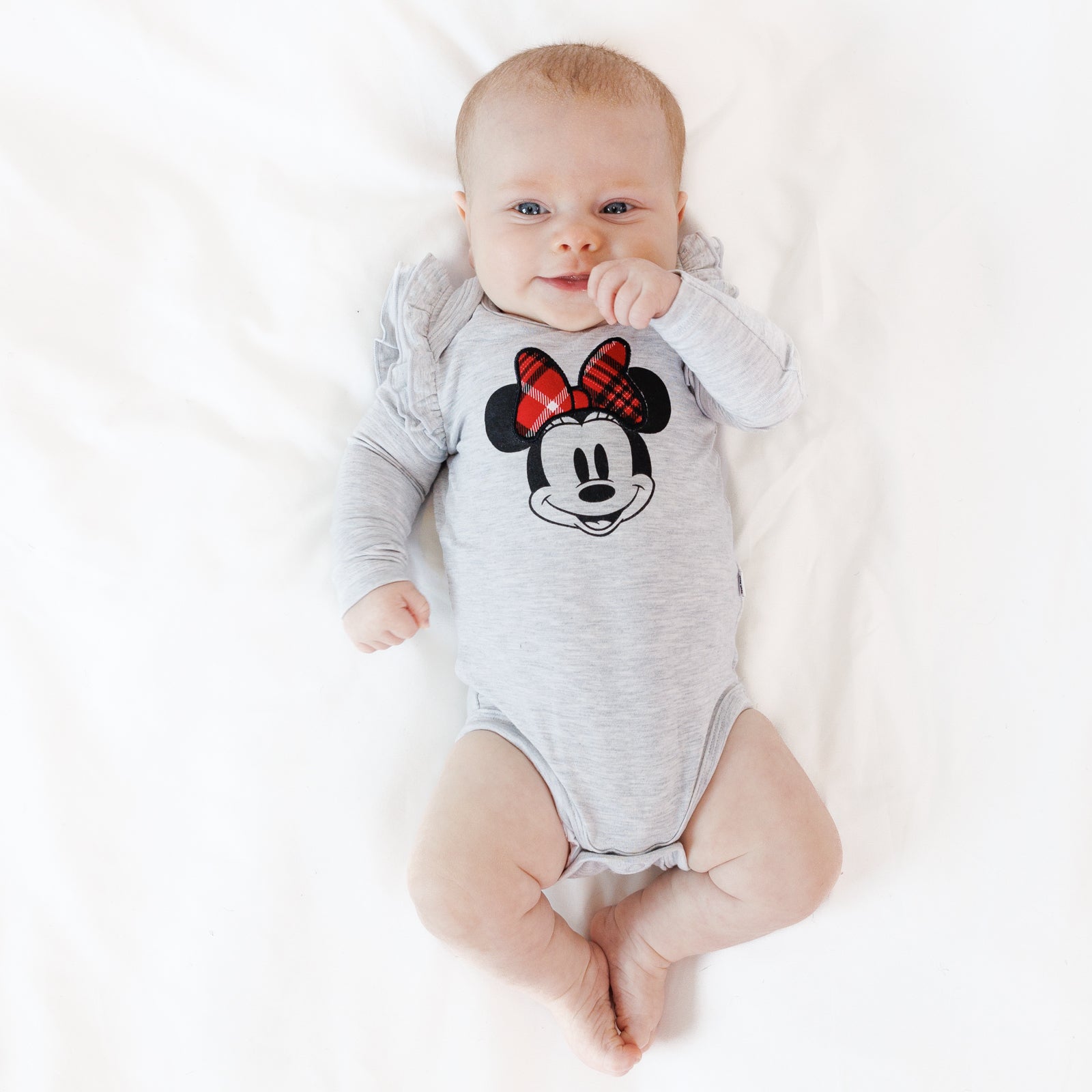 Alternate image of an infant laying on a blanket wearing a Vintage Minnie Flutter Bodysuit