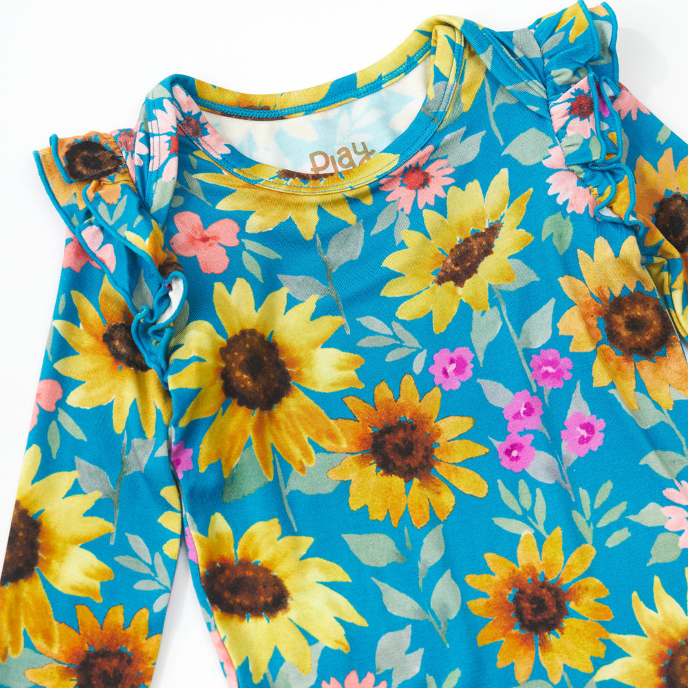 Close up detail shot of a Sunflower Fields Flutter Bodysuit