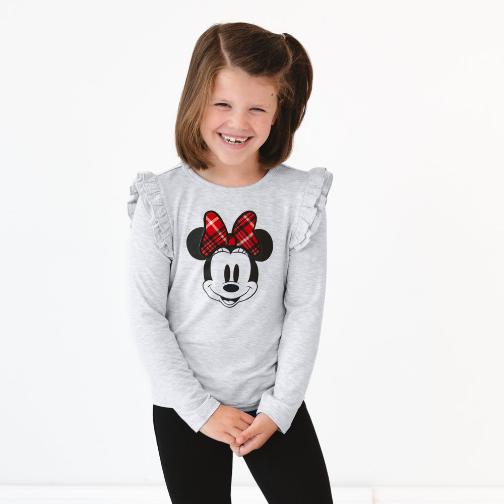 Image of a child laughing wearing a Vintage Minnie Flutter Tee and Black Denim Jegging