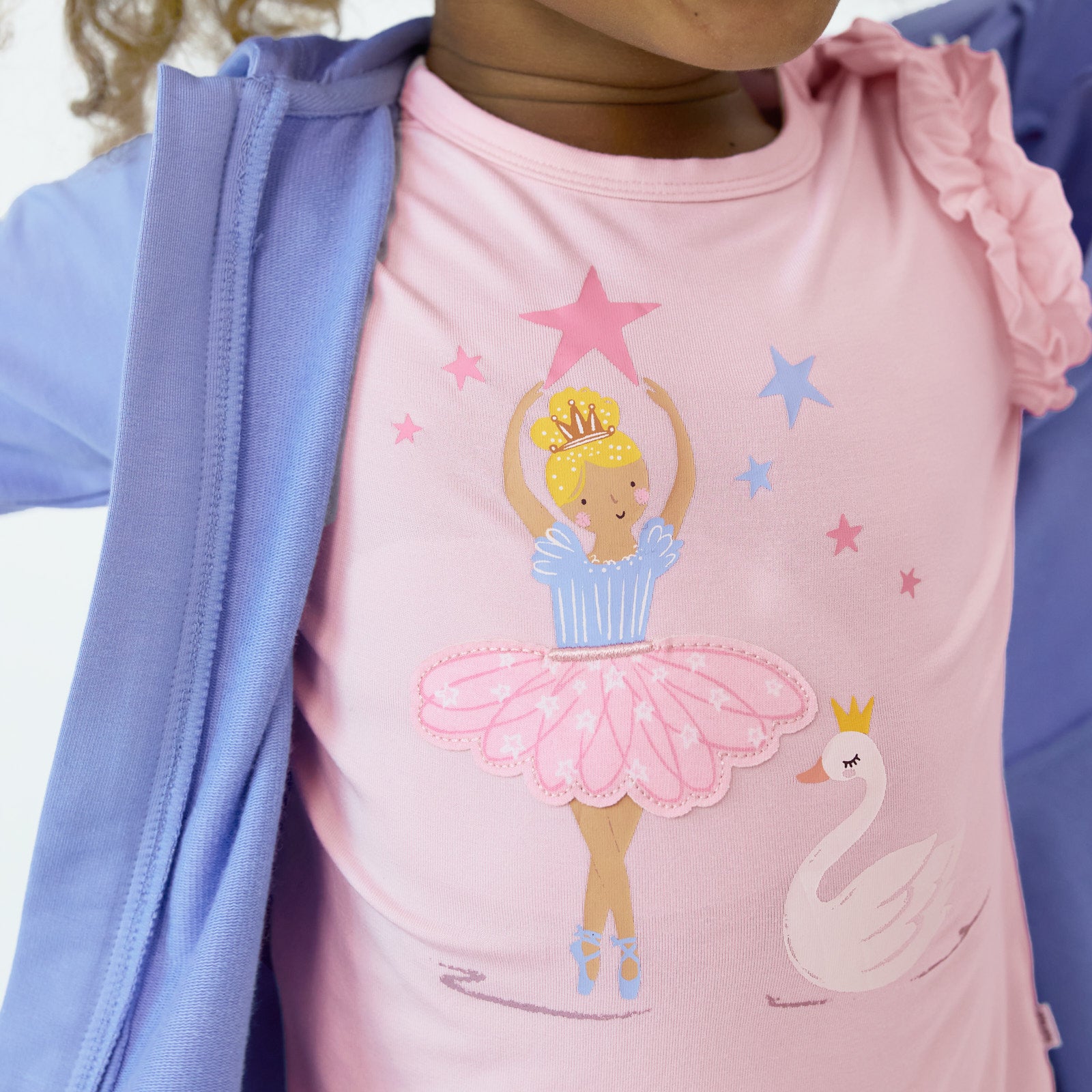 Close up image of child wearing the Prima Pink Flutter Tee