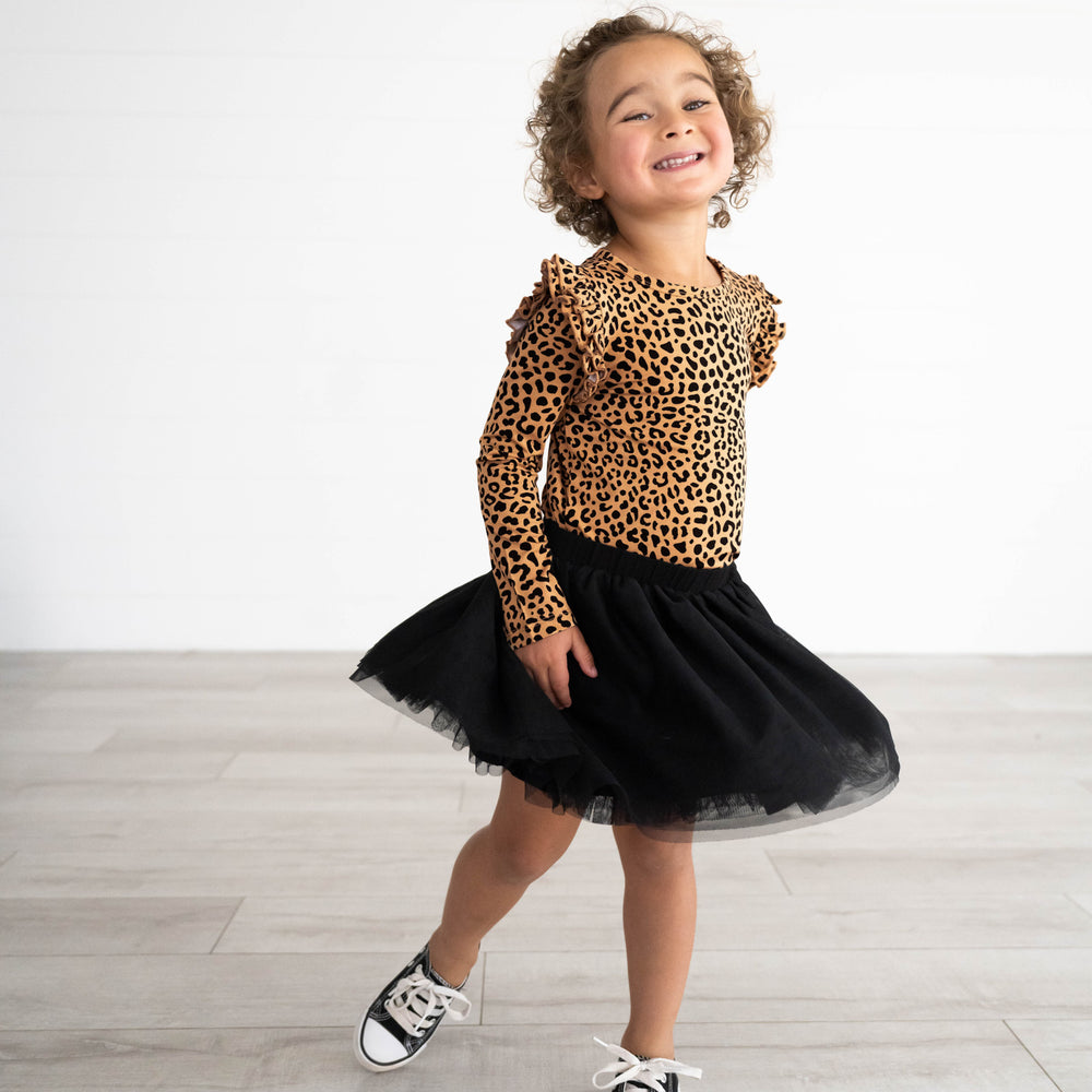 Additional image of girl posing and wearing the Classic Leopard Flutter Tee and Black Tutu Skirt