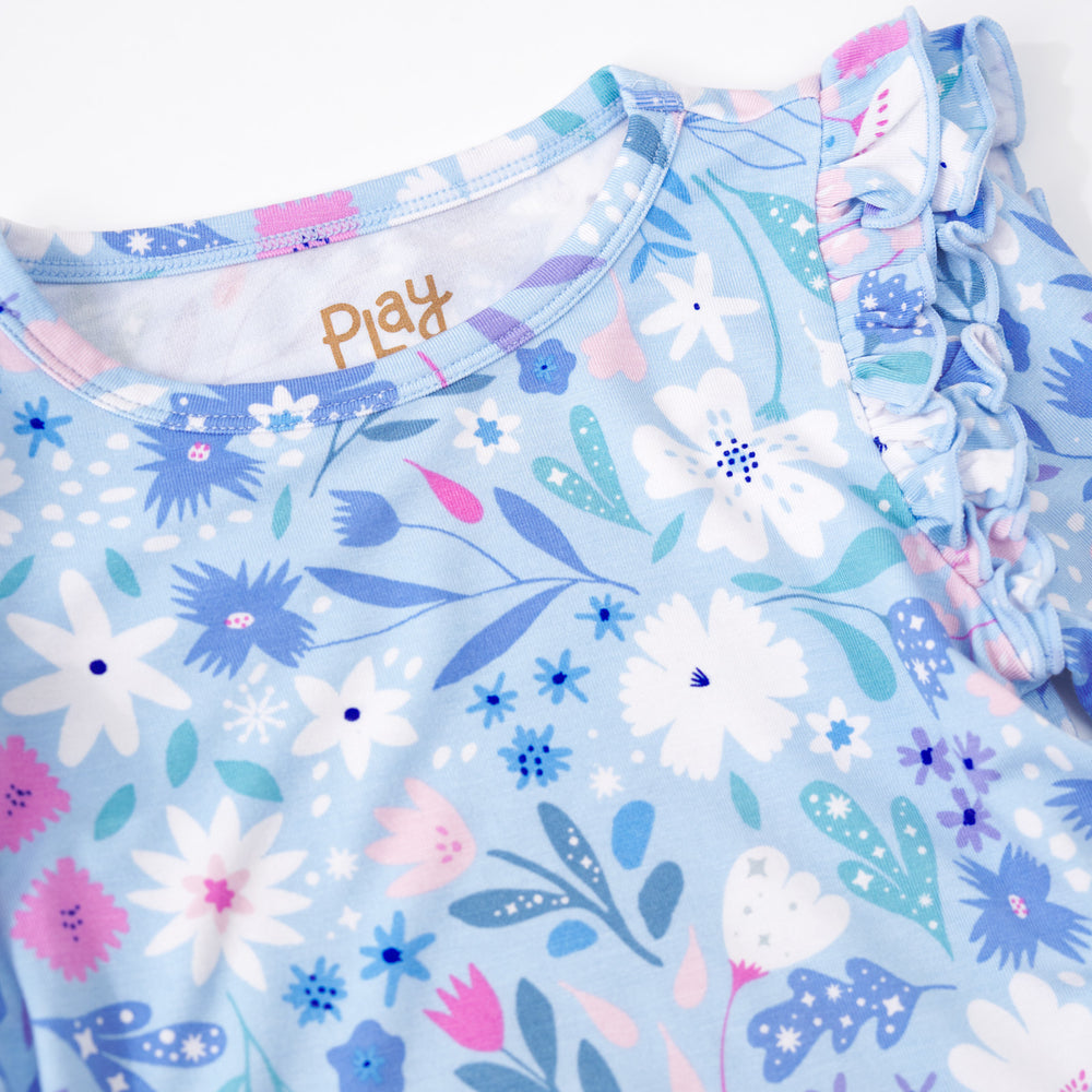 Close up detailed shot of the flutter sleeve on a Magical Meadow Bow Back Skater Dress with Bodysuit