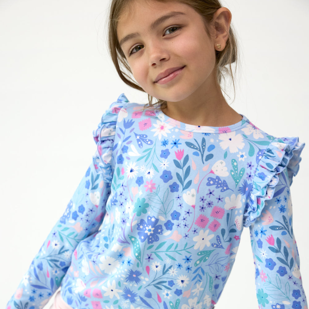 Close up image of girl wearing the Magical Meadow Flutter Tee