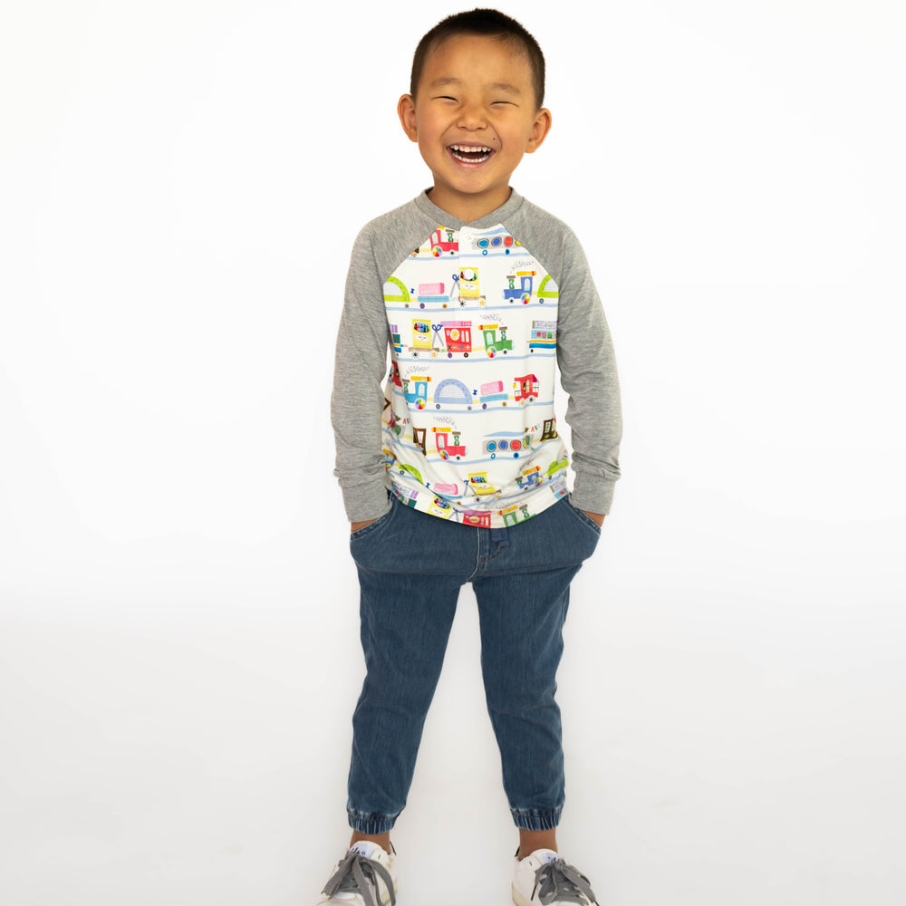 Child outfitted in the Education Express Raglan Henley Tee