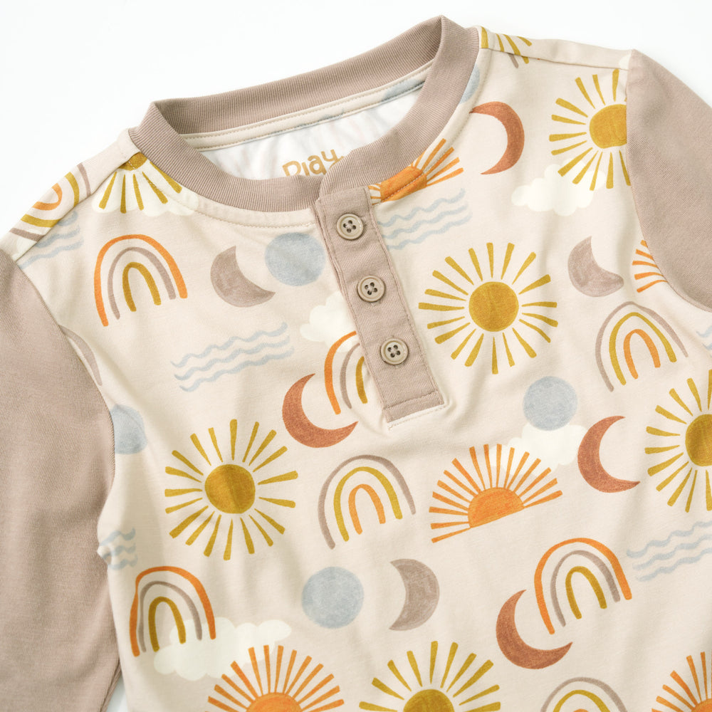 Close up detail shot of a Desert Sunrise Henley Tee