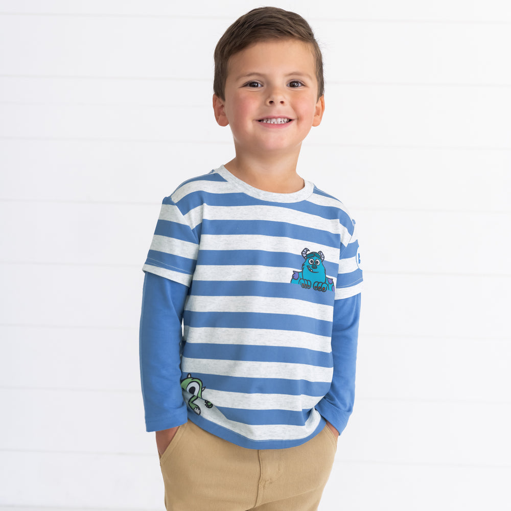 Smiling boy modeal wearing the Disney Monsters, Inc. Layered Tee