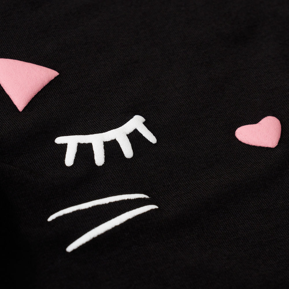 Alternative close up image of the graphic detail and 3D effect on the Black Cat Graphic Flutter Bodysuit