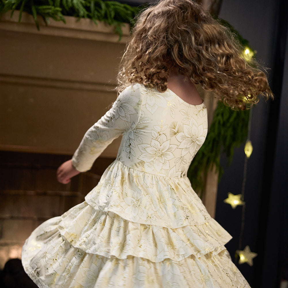 Image of a girl spinning around wearing a Golden Blooms Tiered Tutu Dress