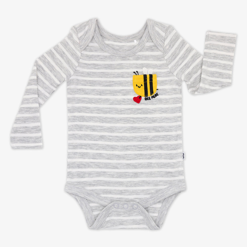 flat lay of a bee mine pocket bodysuit featuring white and heather gray stripes and a bee shaped pocket