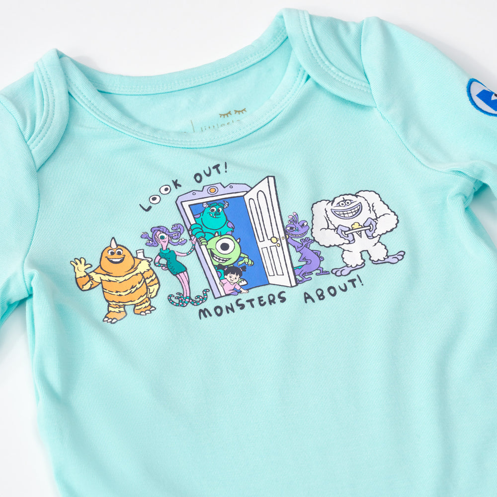 Close up flat lay image of the Disney Monsters, Inc. Bodysuit