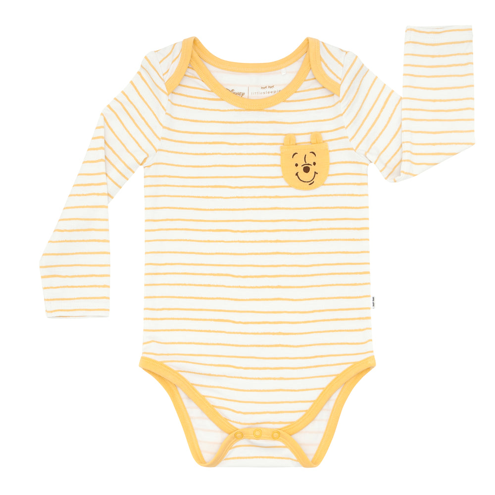 Click to see full screen - Flat lay image of a Disney Winnie the Pooh graphic pocket bodysuit