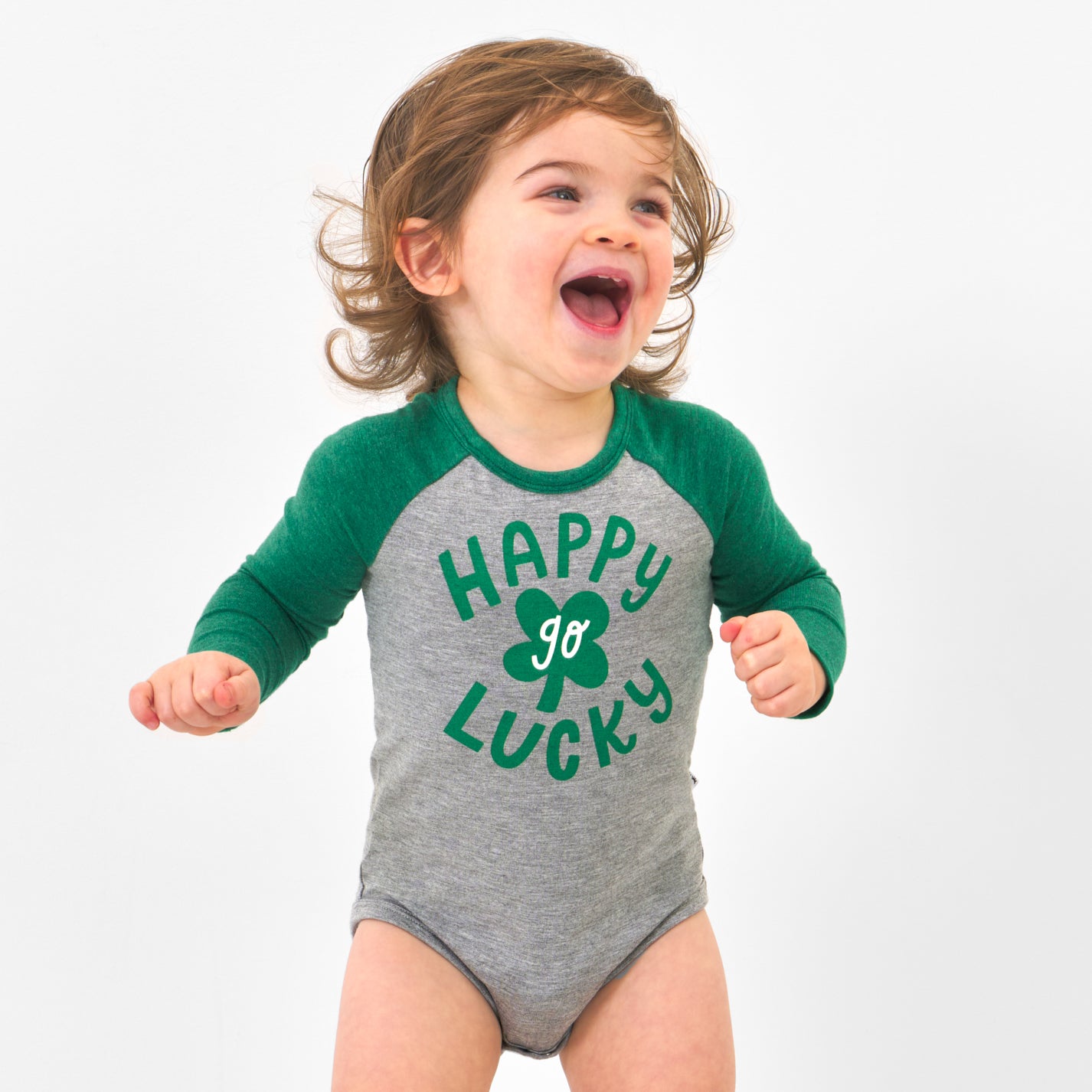Child wearing a Happy Go Lucky graphic bodysuit