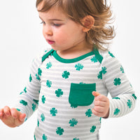 Close up image of a child wearing a Lucky Stripes pocket bodysuit
