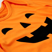 Close up flat lay image of the collar & graphic detail on a Jack-O'-Lantern Graphic Bodysuit