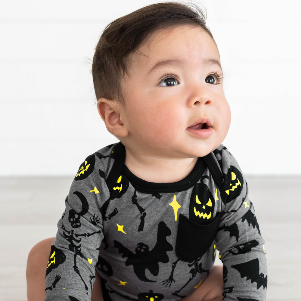 Alternative close up image of baby wearing the Gray Glowing Ghouls Pocket Bodysuit