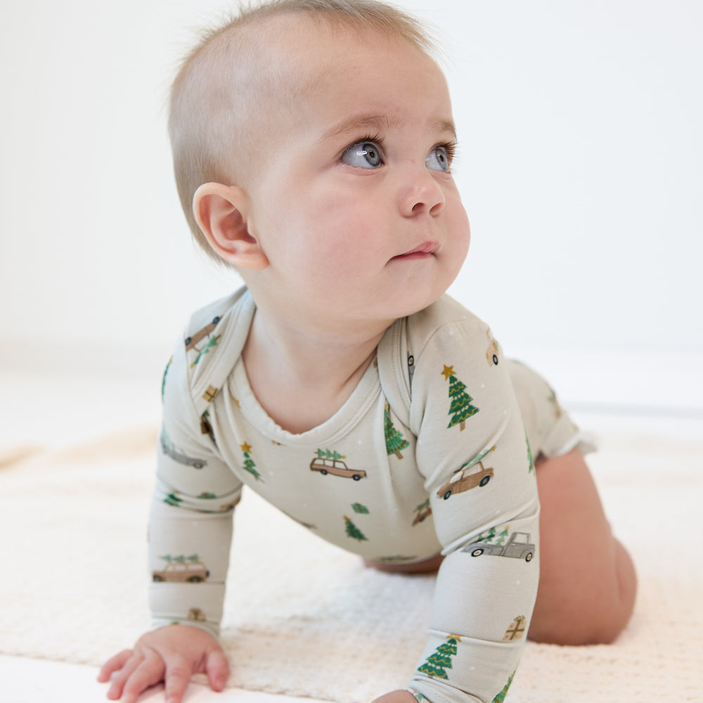 Image of a child crawling wearing a Tree Traffic Bodysuit