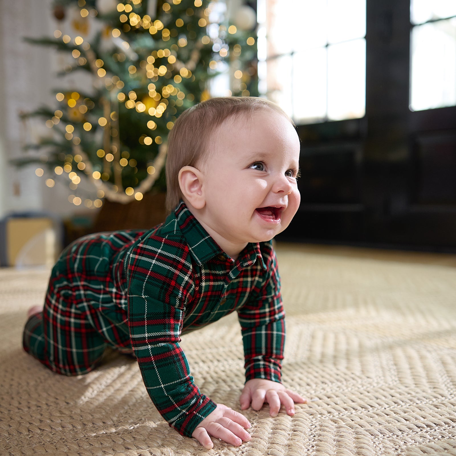 Image of a child crawling wearing an Evergreen Plaid Polo Romper