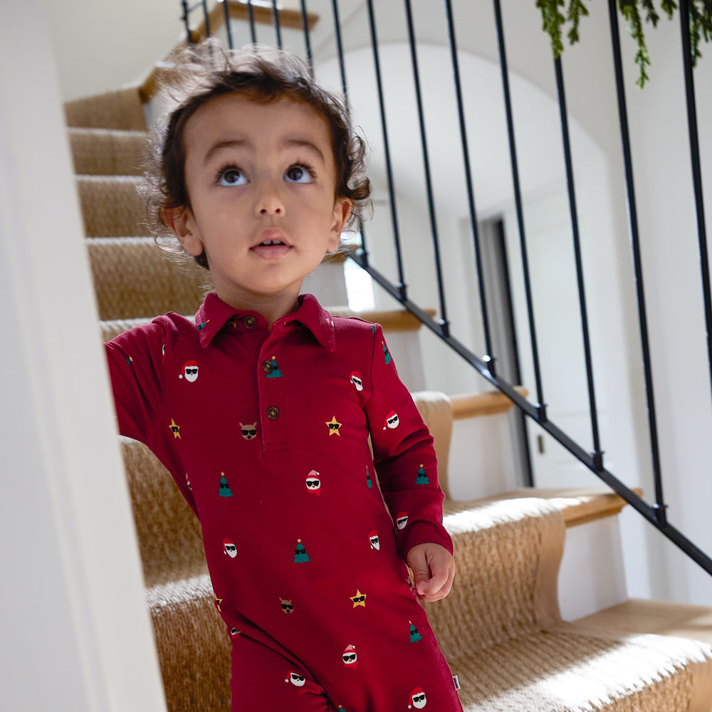 Close up image of a child wearing a Cool Christmas Polo Romper