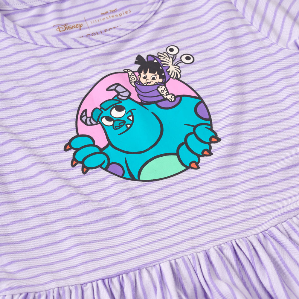 Close up, flat lay image of the graphic detail on the Disney Monsters, Inc. Peplum Tee