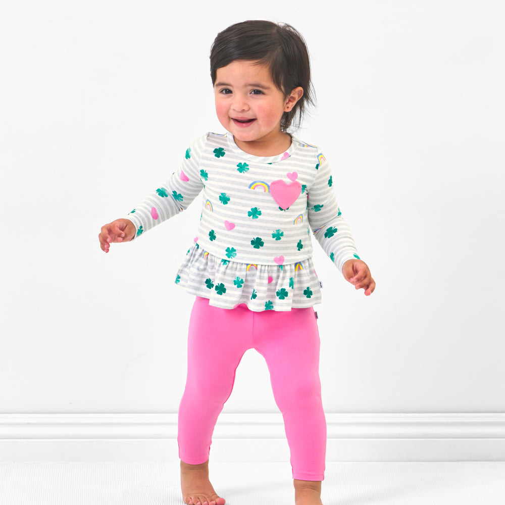 Click to see full screen - Close upChild wearing Sweet Pink Leggings paired with a Lucky in Love pocket peplum tee