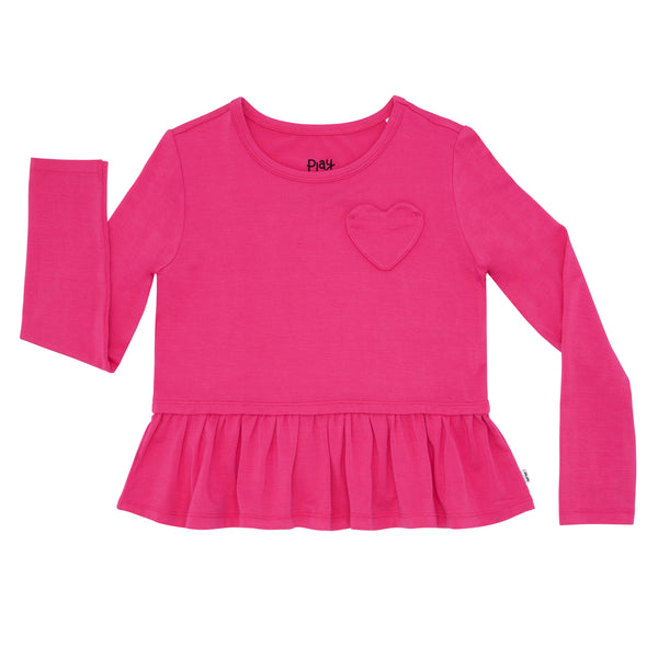 Flat lay image of a Pink Punch peplum tee