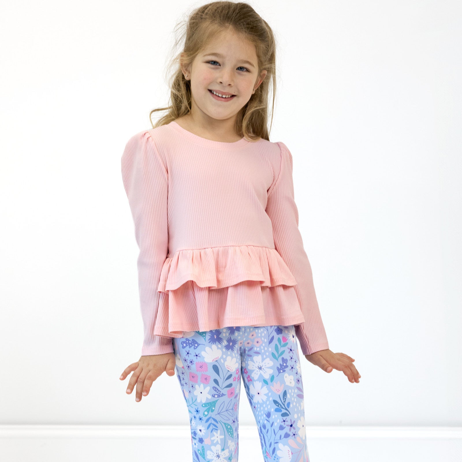 Alternative image of girl posing while in the Prima Pink Ribbed Tiered Peplum Top and Magical Meadows Leggings