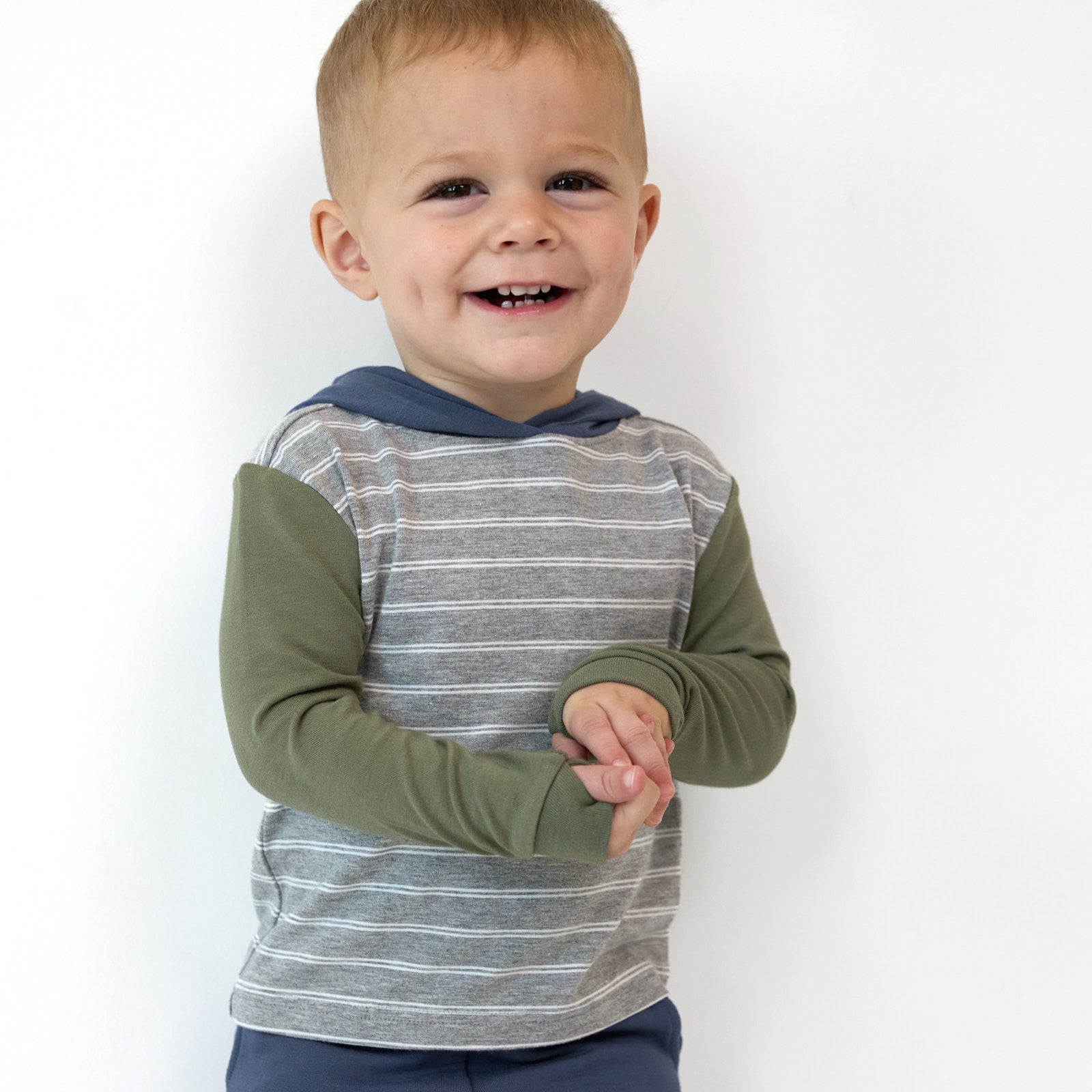 Close up image of a boy wearing a Light Heather Gray Stripes Hooded Tee