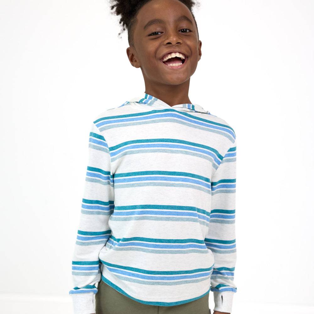 Smiling boy wearing the Cool Stripes Relaxed Hooded Tee