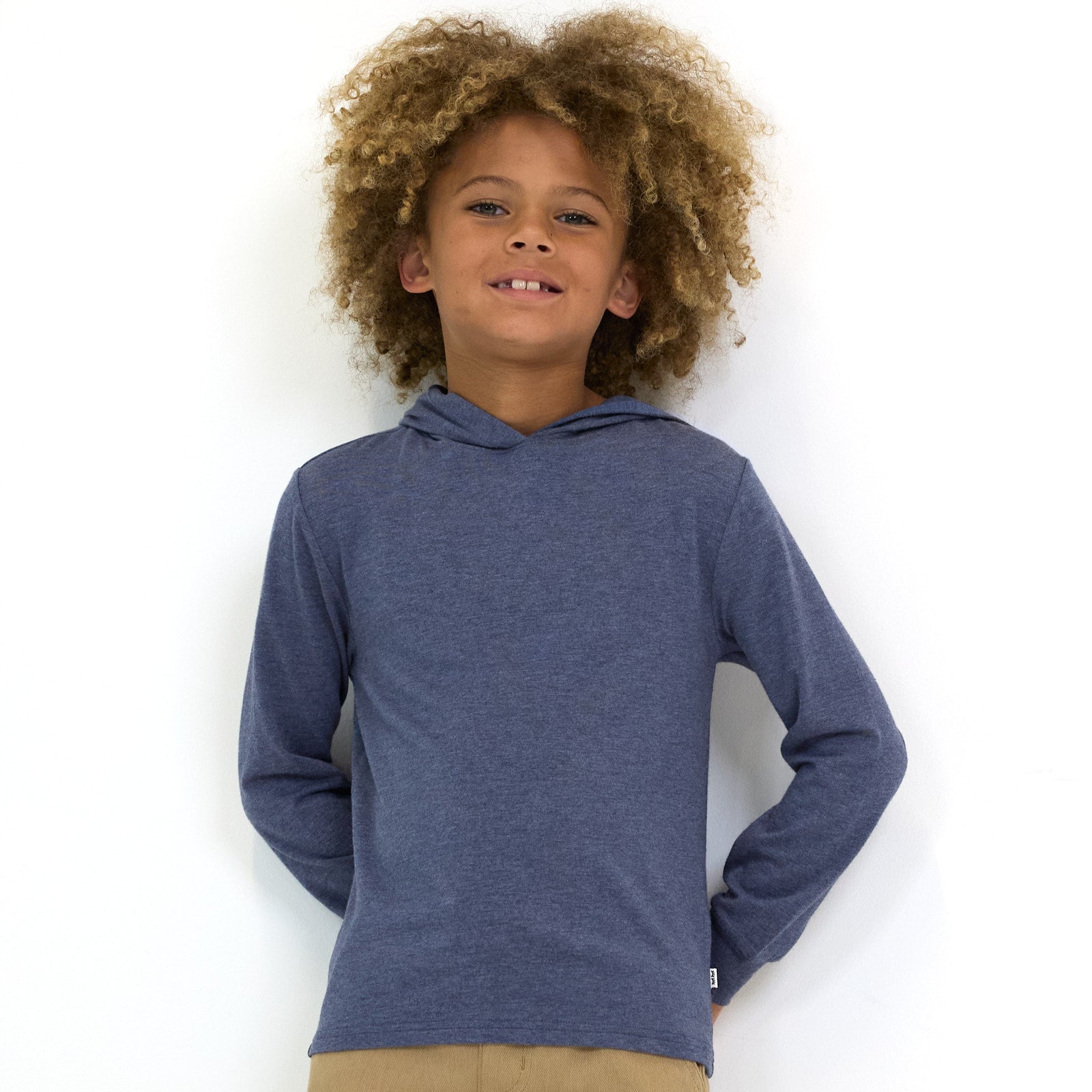 Close up image of child wearing the Vintage Navy Relaxed Hooded Tee