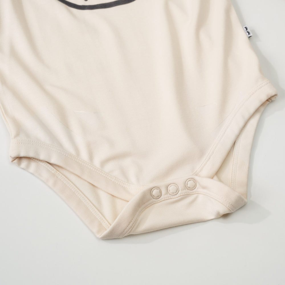 Close-up view of the button snaps on an Arctic Raglan baby bodysuit