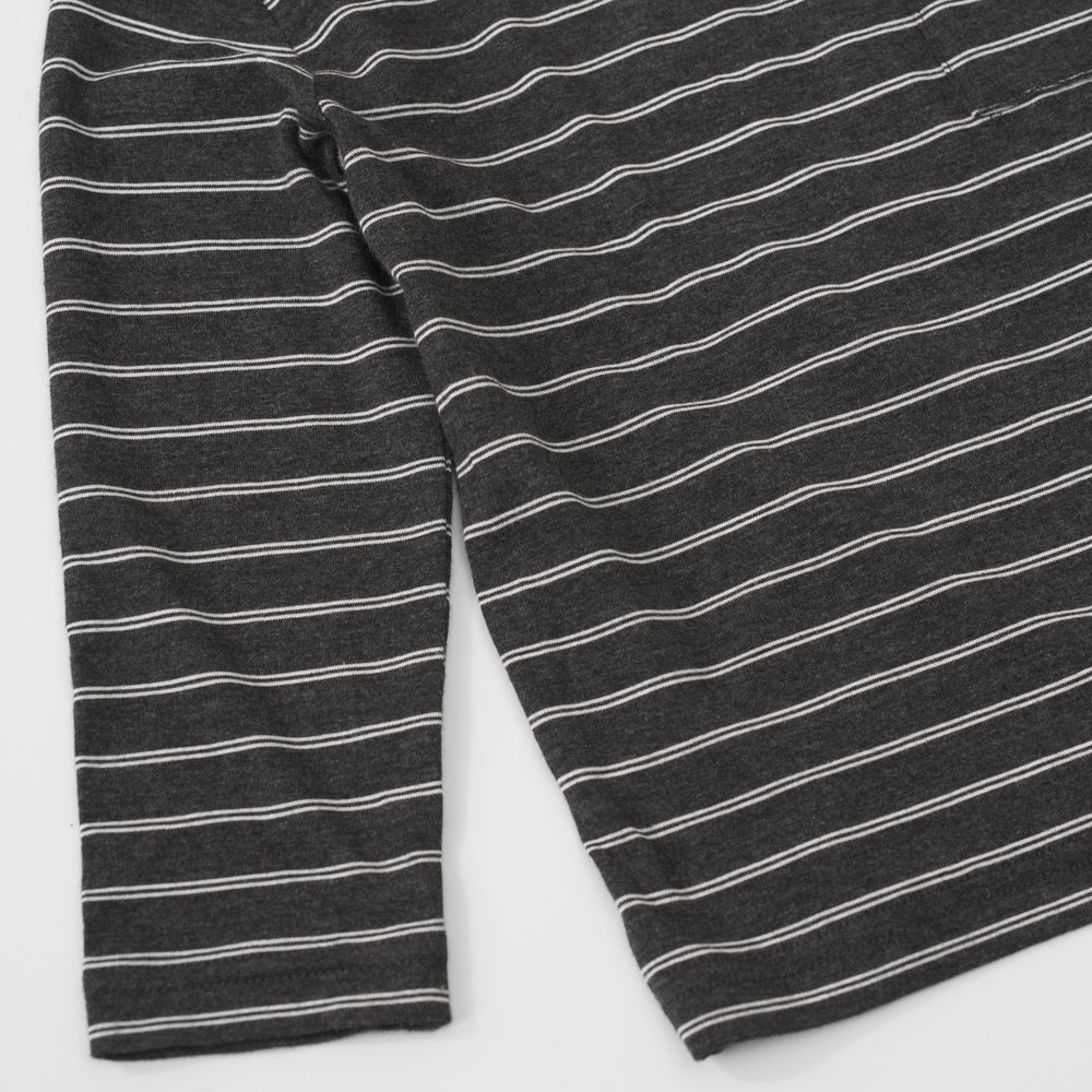 Close-up view of the white stripe pattern on a Heather Black Stripes long sleeve relaxed pocket tee