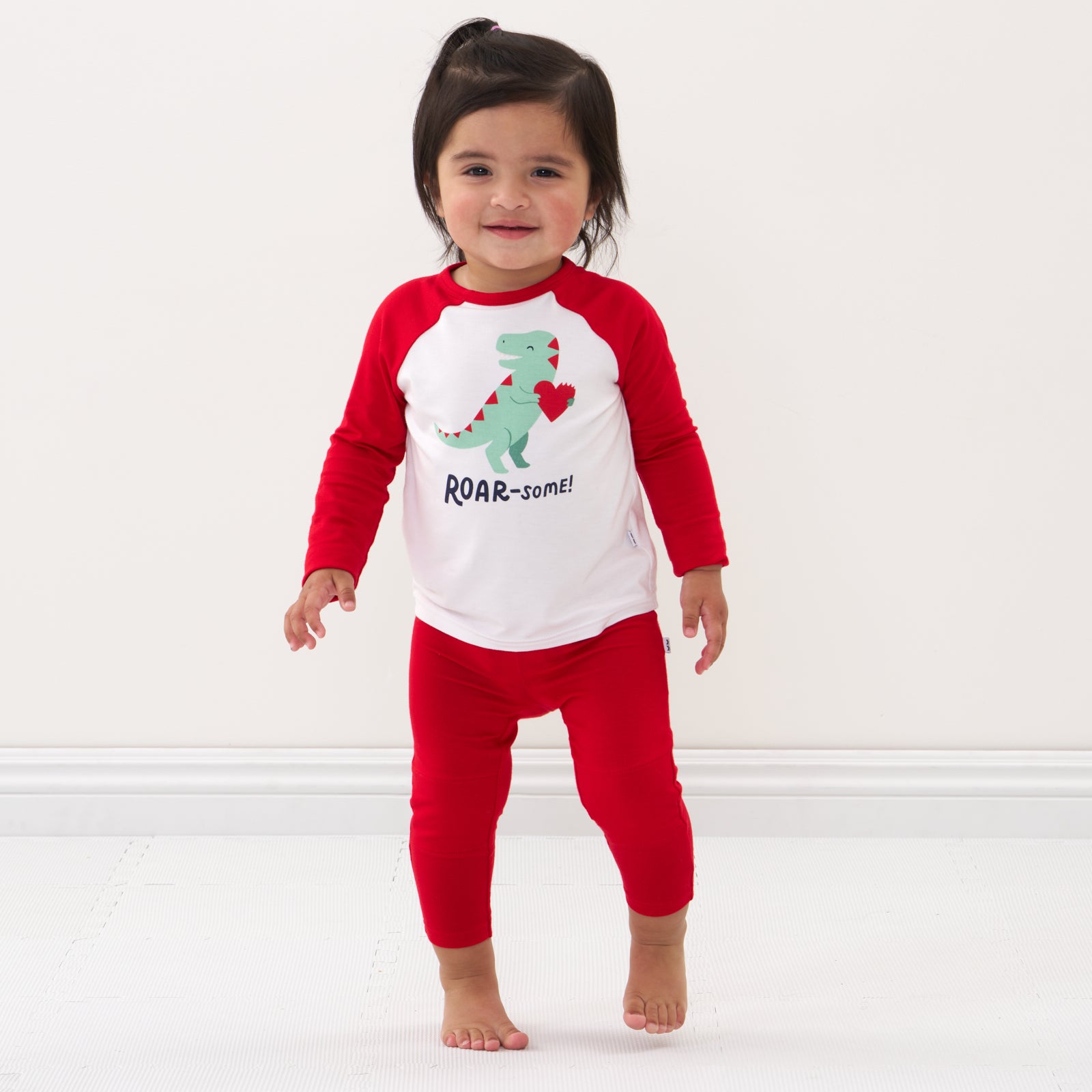 Child wearing Candy Red leggings and coordinating top
