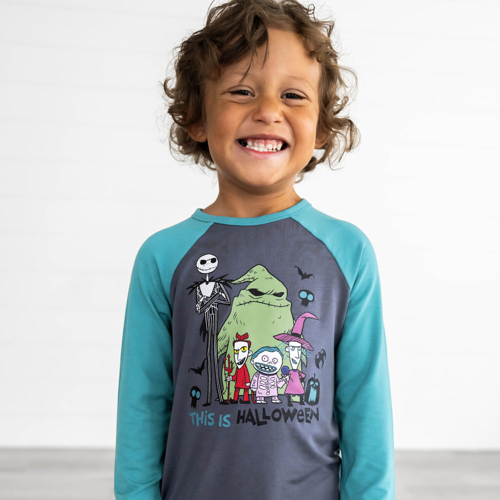 Child smiling while wearing the Disney Jack & Crew Graphic Raglan Tee