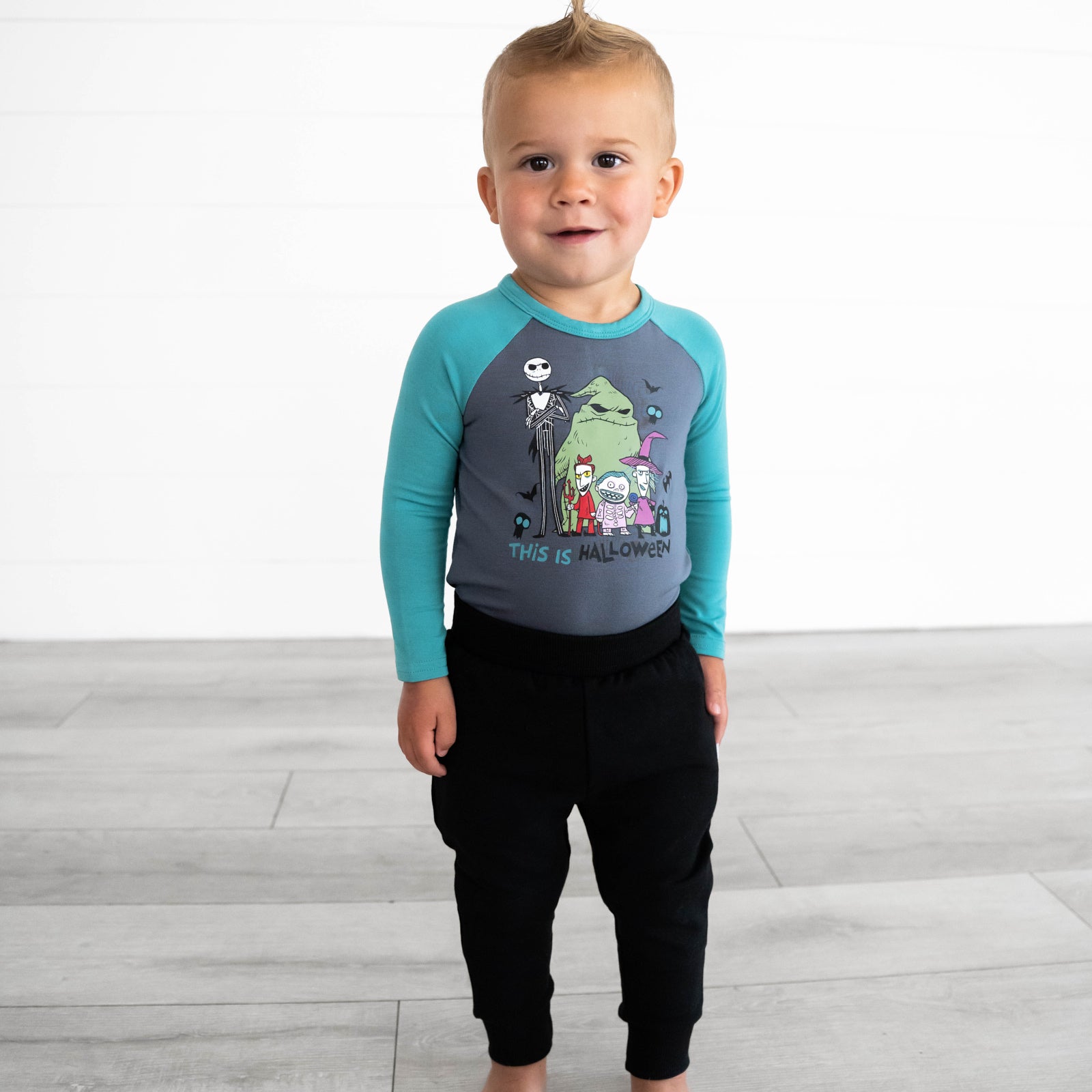 Child wearing the Disney Jack & Crew Graphic Raglan Tee and Black Play Joggers