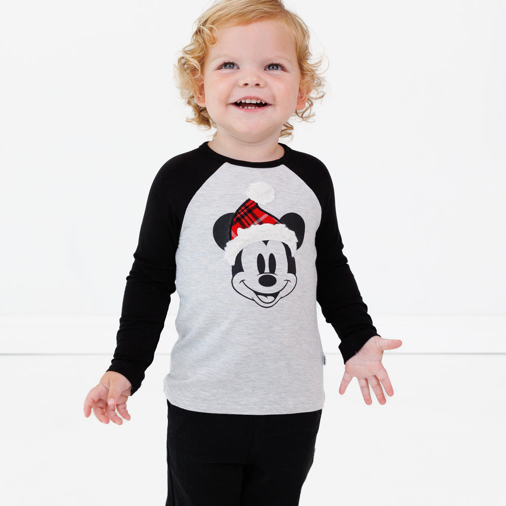 Image of a child wearing a Vintage Mickey Raglan Tee and Black Denim Jogger