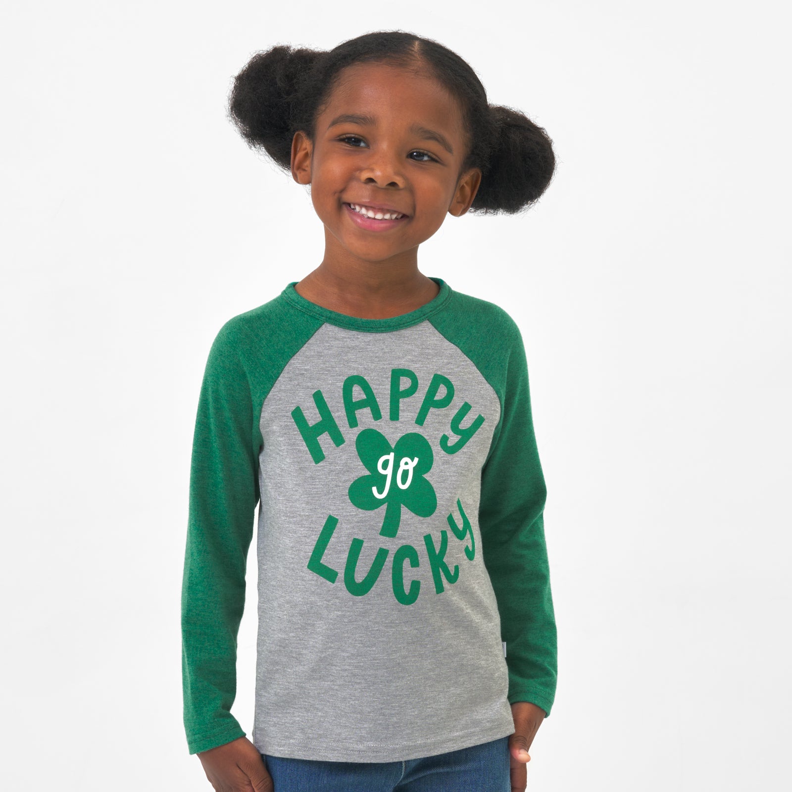 Child wearing a Happy Go Lucky raglan tee