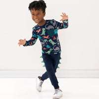 Child playing wearing a Blue Prehistoric Pals pocket tee and coordinating joggers