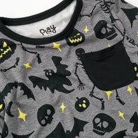 Close up flat lay image of the collar & pocket detail on a Gray Glowing Ghouls Pocket Tee