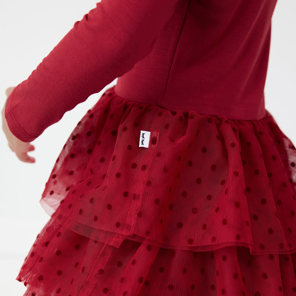 Close up detail image of a child wearing a Snowflake Tiered Tutu Dress