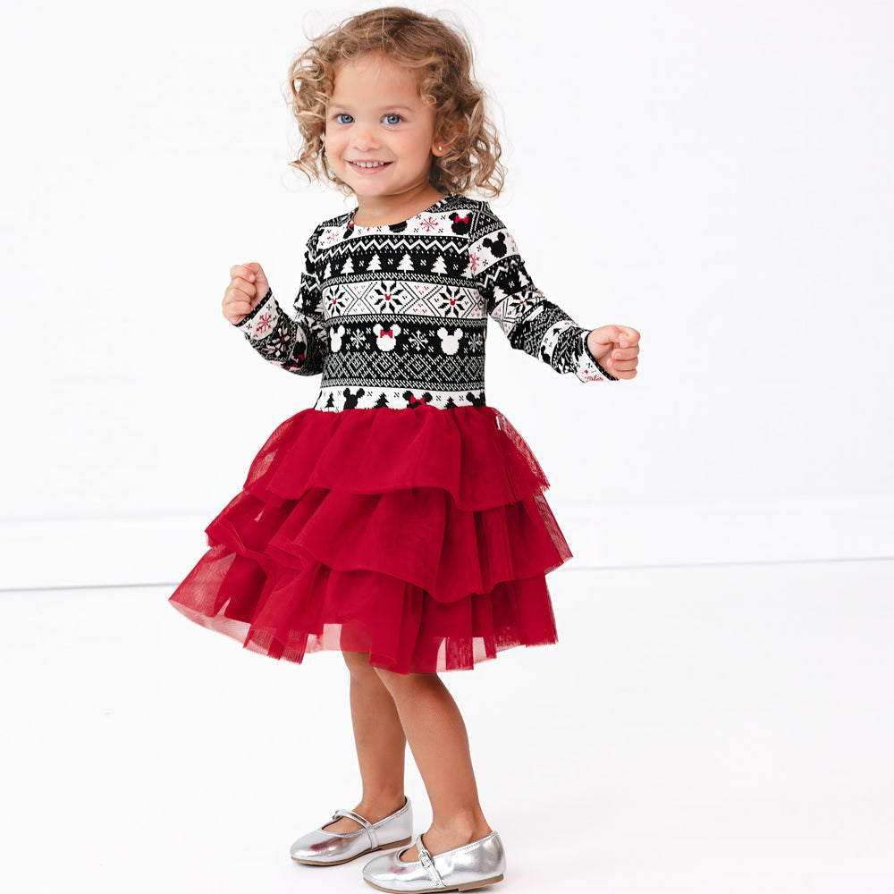 Image of a child spinning around wearing a Mickey Fair Isle Tiered Tutu Dress with Bloomer