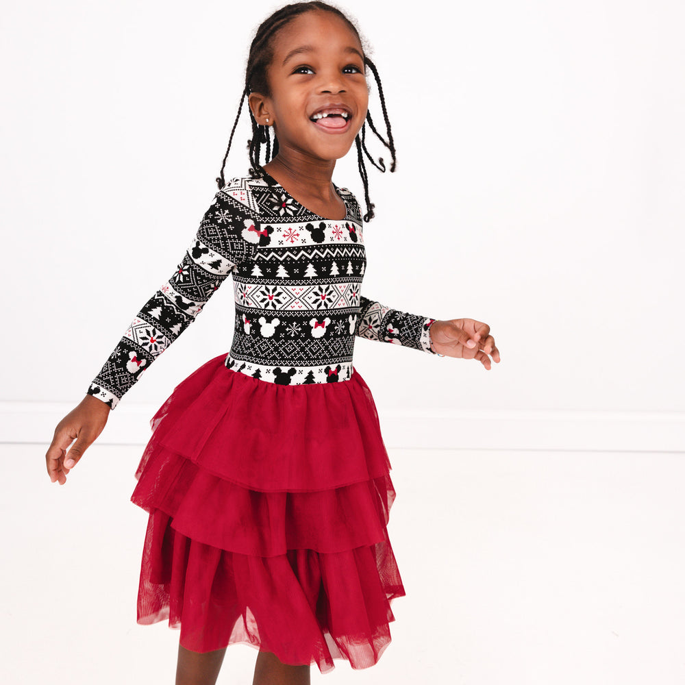 Close up image of a child wearing a Mickey Fair Isle Tiered Tutu Dress