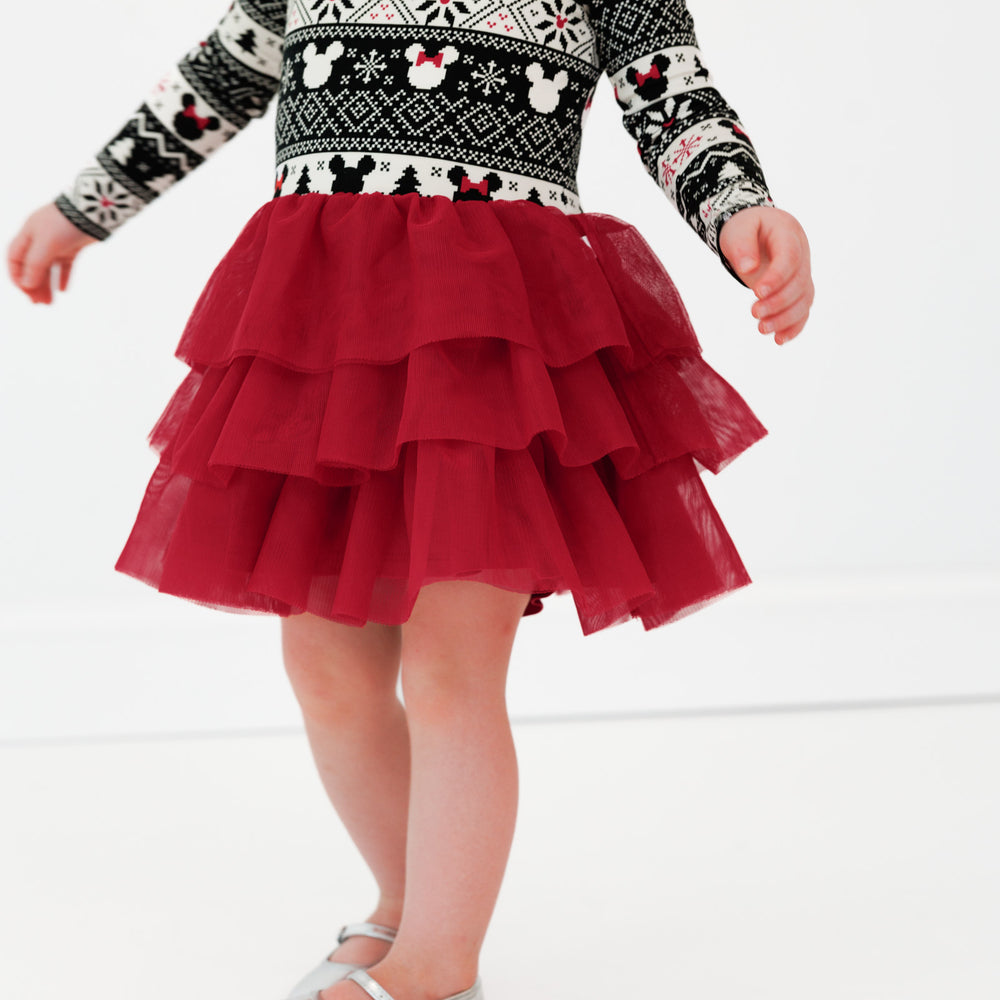 Close up image of a child wearing a Mickey Fair Isle Tiered Tutu Dress with Bloomer