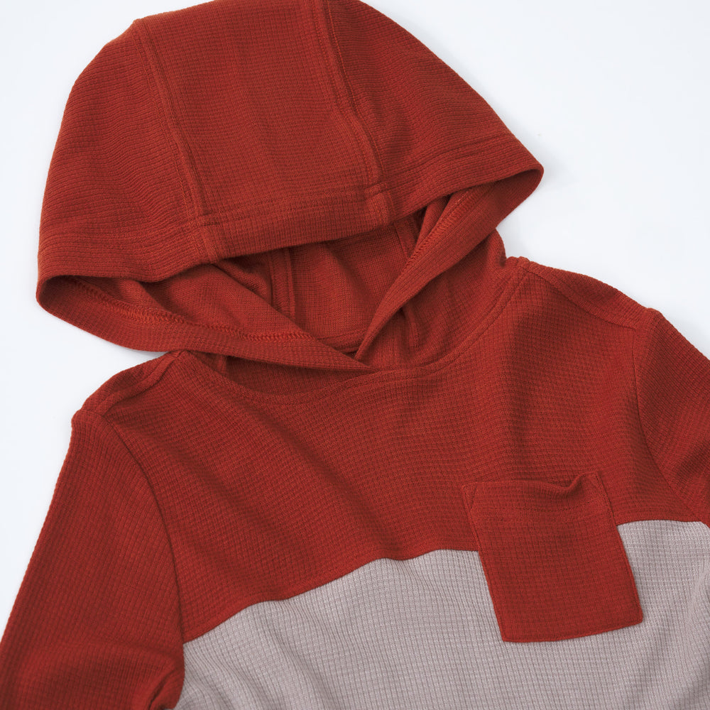 Close up detail shot of a Rust Waffle Hooded Tee