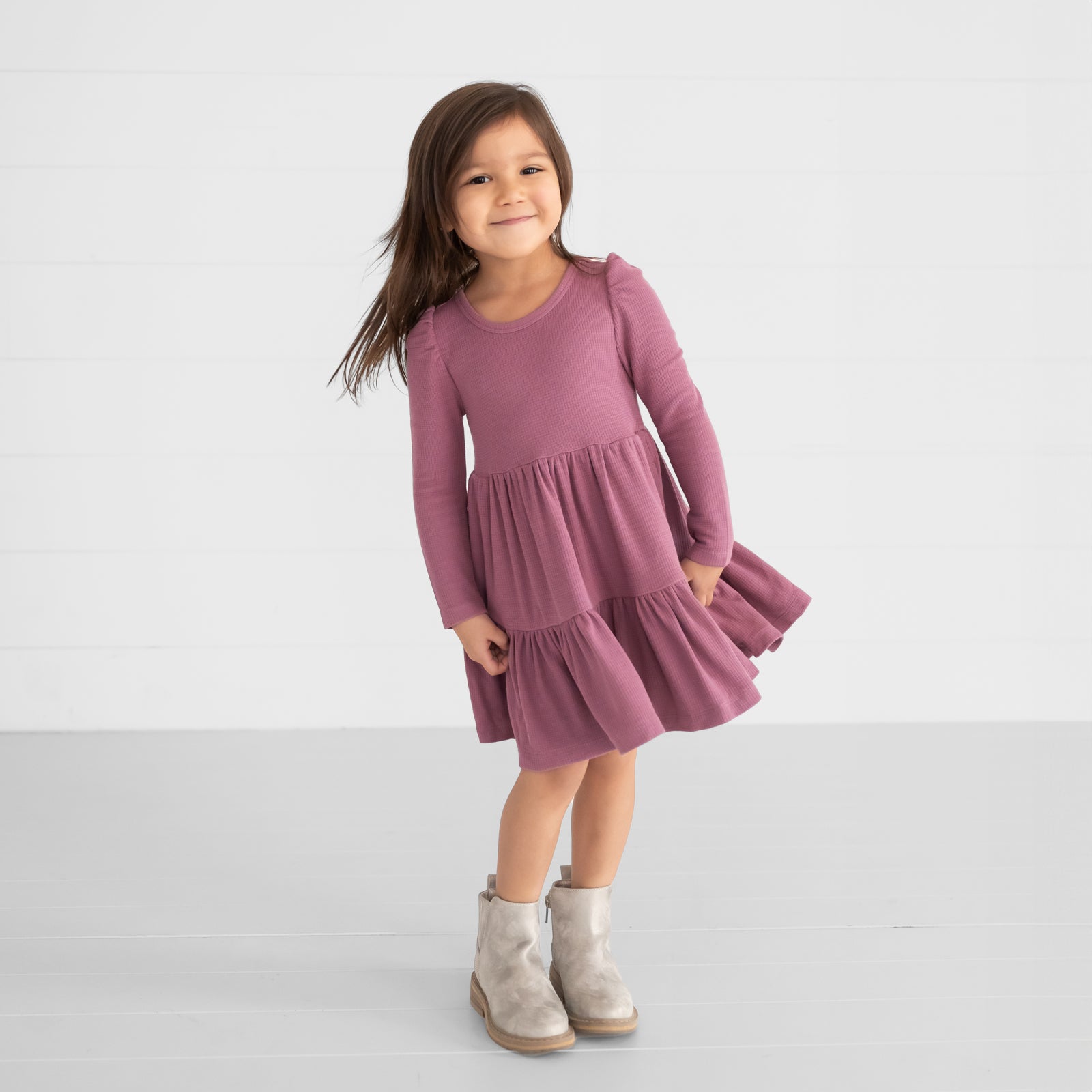 Image of a child wearing a Dusty Plum Waffle Tiered Dress