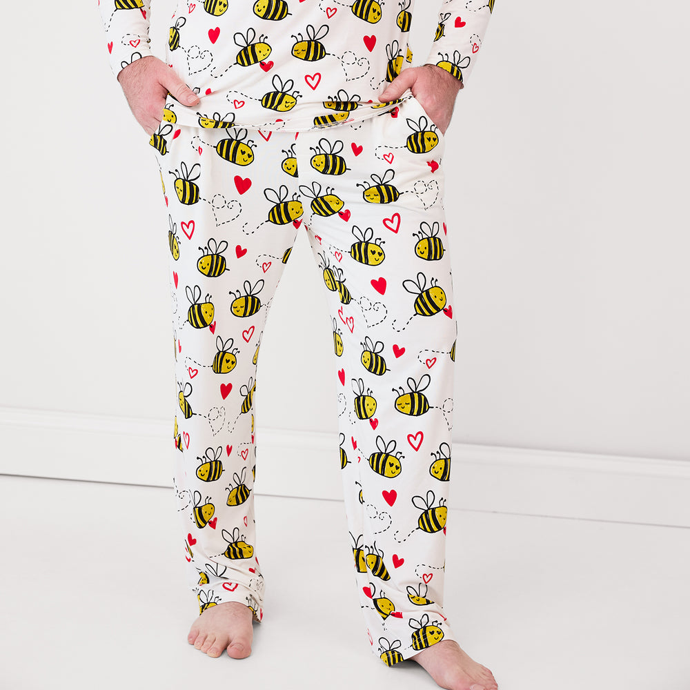 Close up image of a man wearing Bee Mine men's pjs pants