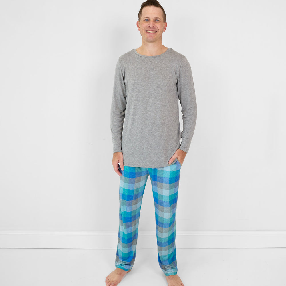 image of a man wearing Arctic Plaid men's pj bottoms and a men's Heather Gray pj top