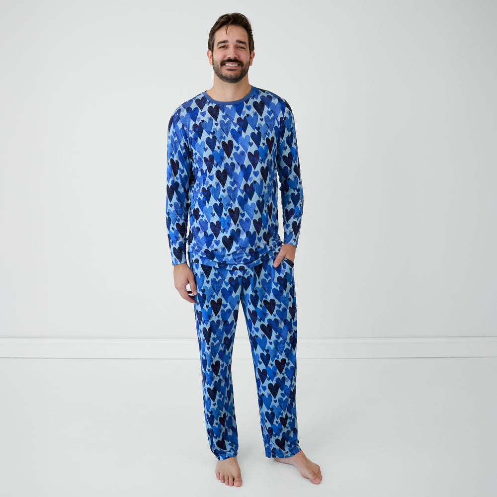 Man in Blue Hearts & Crafts pajama top and pants.