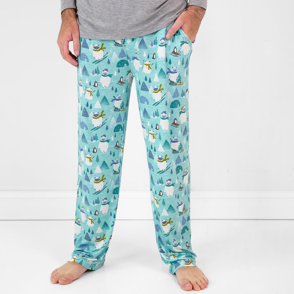 Close up image of a man wearing Yeti Snow Day printed men's pj pants