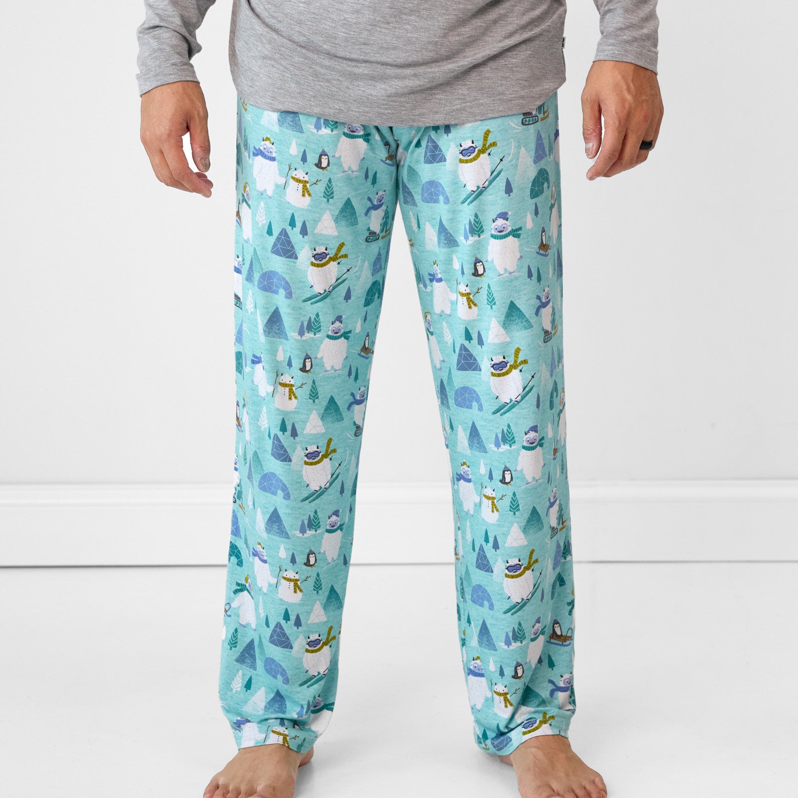 Alternate close up image of a man wearing Yeti Snow Day printed men's pj pants